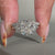 Three stone ring with trillion cut side stones and cathedral setting.