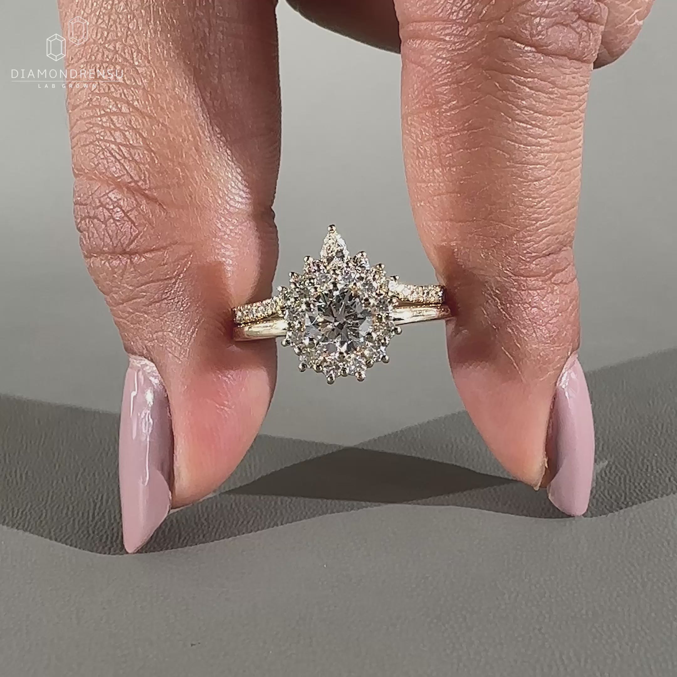 Halo ring with prong setting and matching curved wedding band.