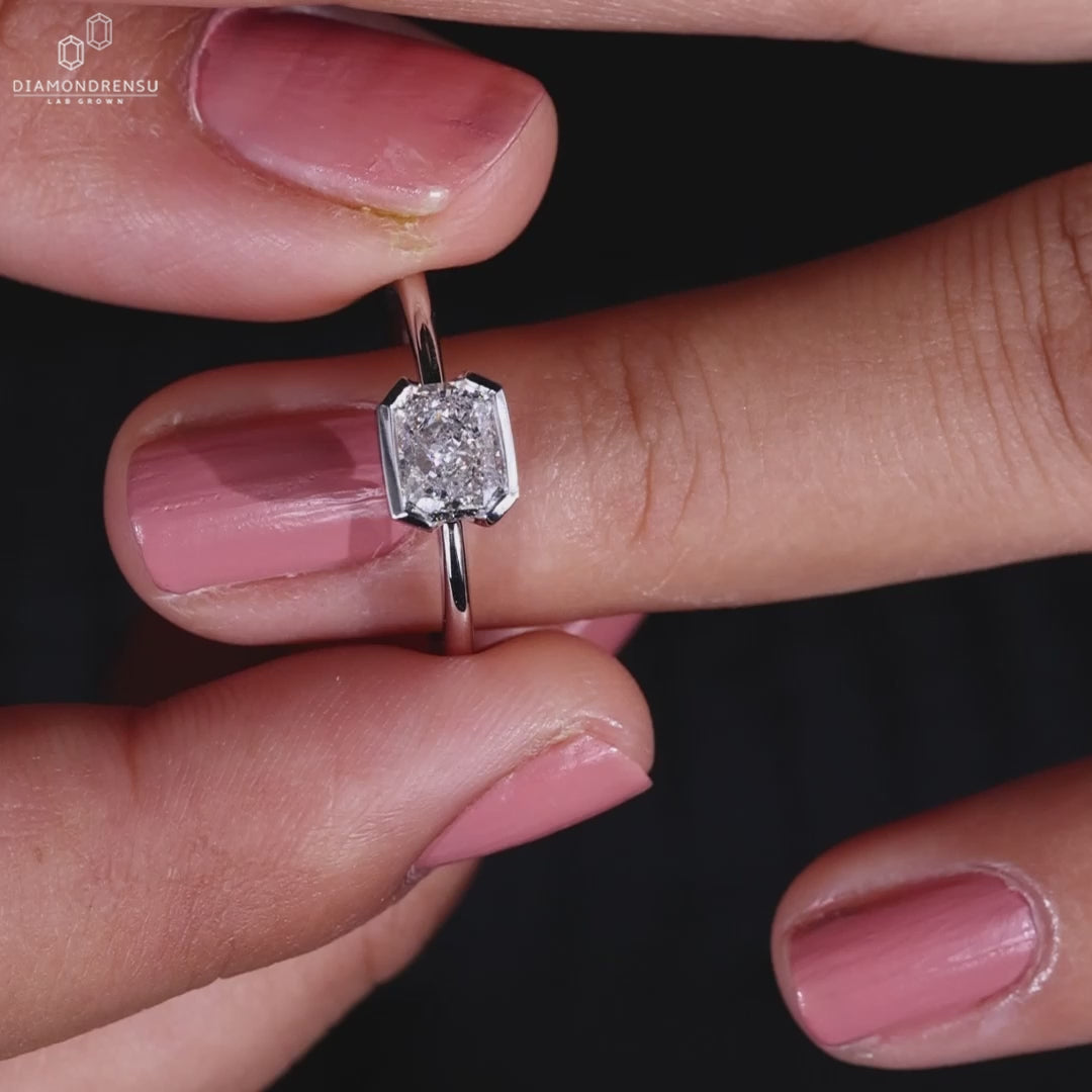 Handmade ring with a half bezel engagement ring design, perfect for a unique radiant engagement ring style.