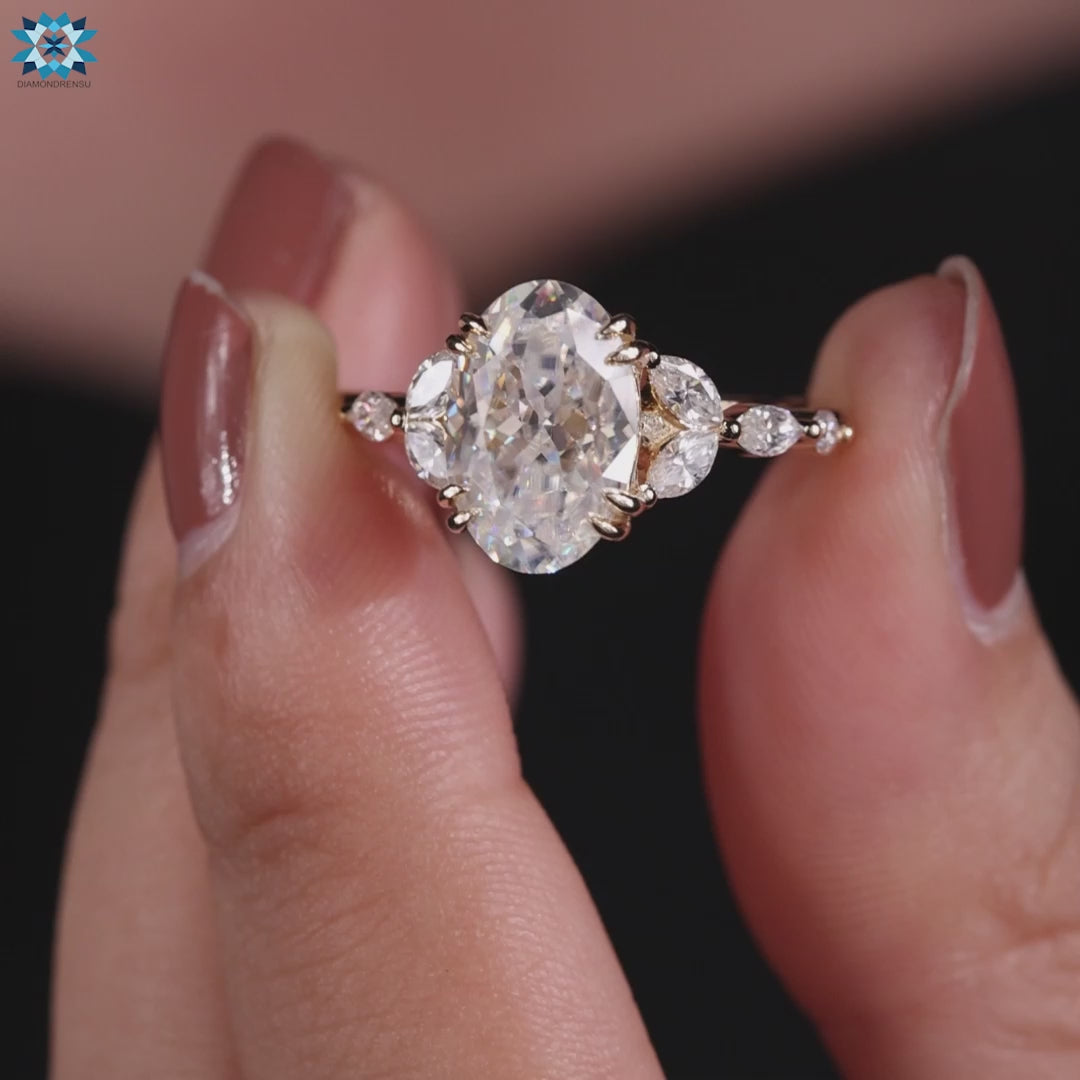 Shared prong engagement ring with oval Rensu moissanite center stone.