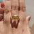 Elegant cathedral ring with canary yellow moissanite and tapered shank.