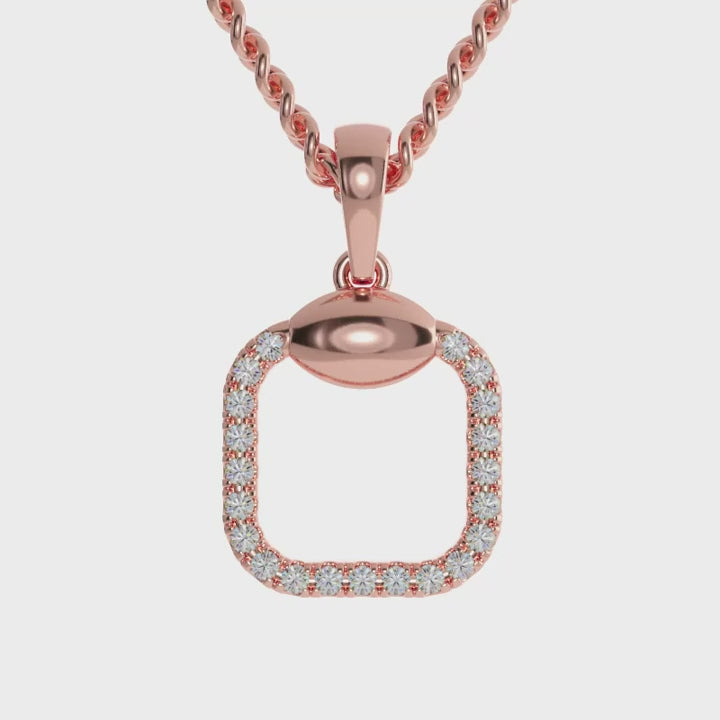 Handmade gold diamond pendant with cushion shaped halo and round centre.