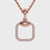 Handmade gold diamond pendant with cushion shaped halo and round centre.