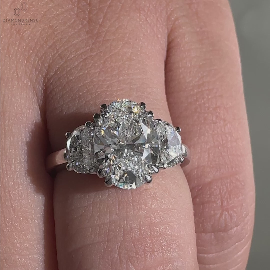 Double claw prong oval engagement ring with three stone ring design, a truly unique engagement ring for women.