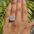 Elegant halo setting ring with cushion moissanite.