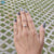 Handmade solitaire ring with rose gold and moissanite.