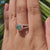 Round moissanite ring with split shank.