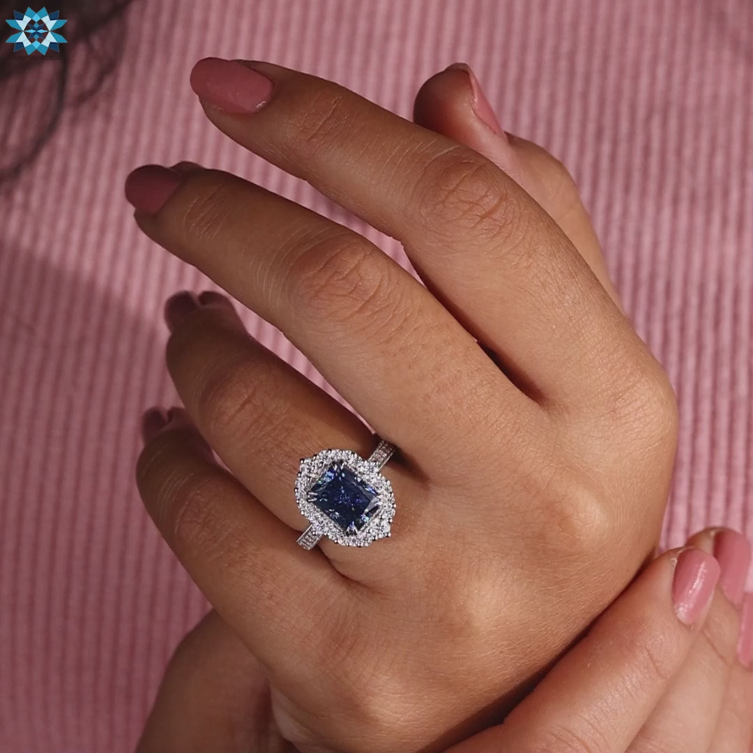 White gold moissanite ring with halo and handcrafted milgrain.