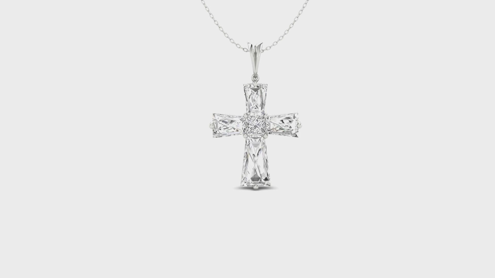 Elegant pendant with cross motif and prong set diamonds.