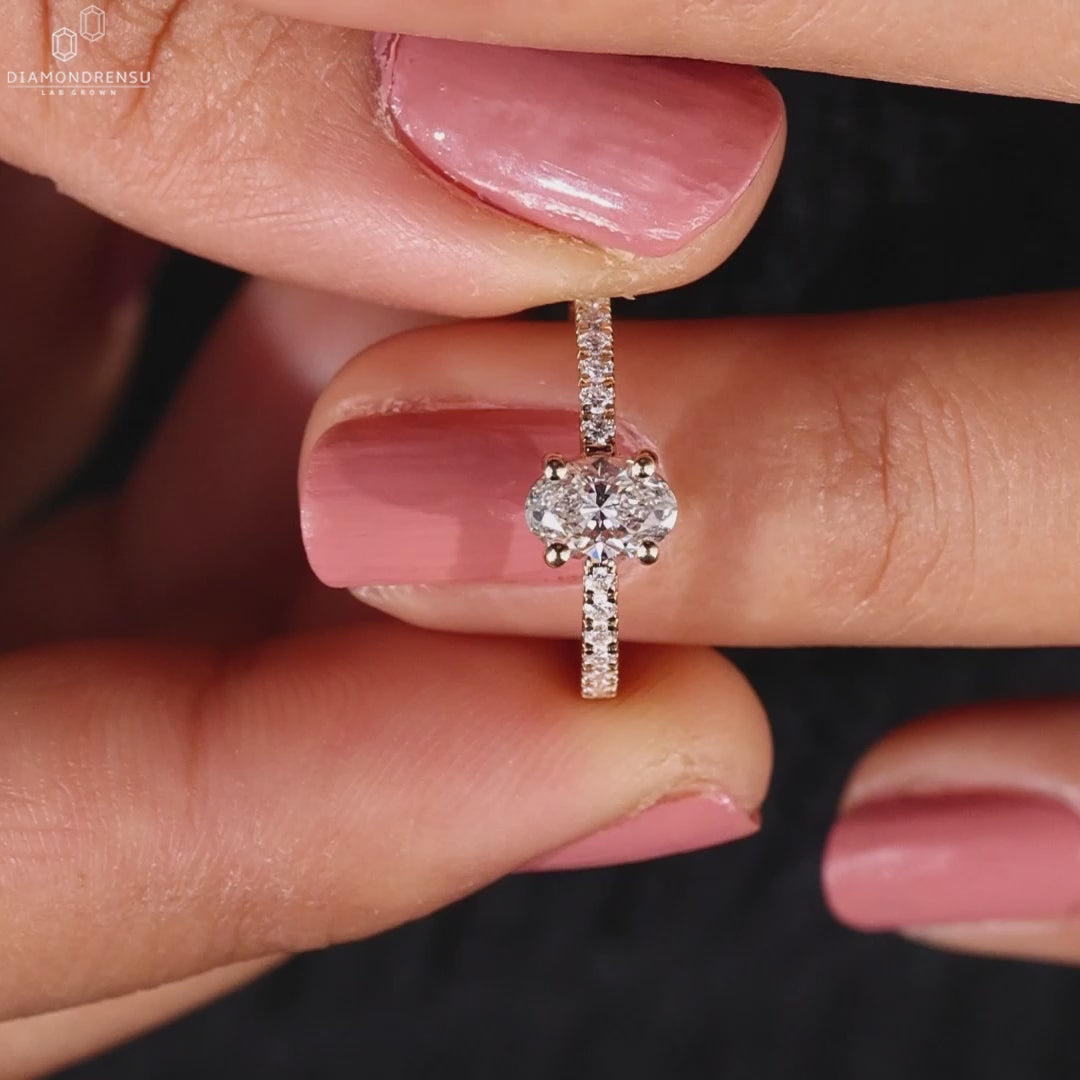 Engagement ring with pave diamonds and handmade jewellery detailing for a truly unique piece.