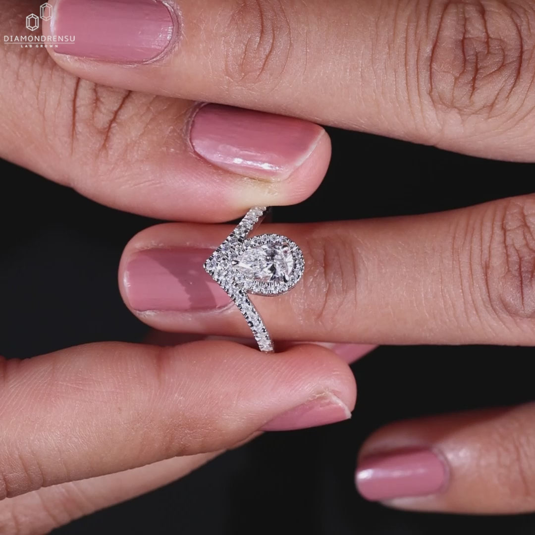 Handmade ring with pave setting and a pear engagement ring design, crafted to be an unforgettable gift.