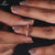 Round cut diamond semi eternity wedding band.