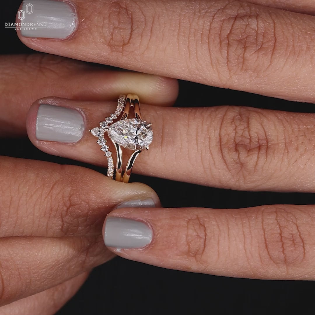 Yellow gold pear shape engagement ring set.