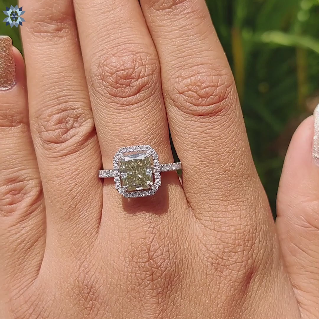 Moissanite engagement ring crafted with halo setting in white gold.