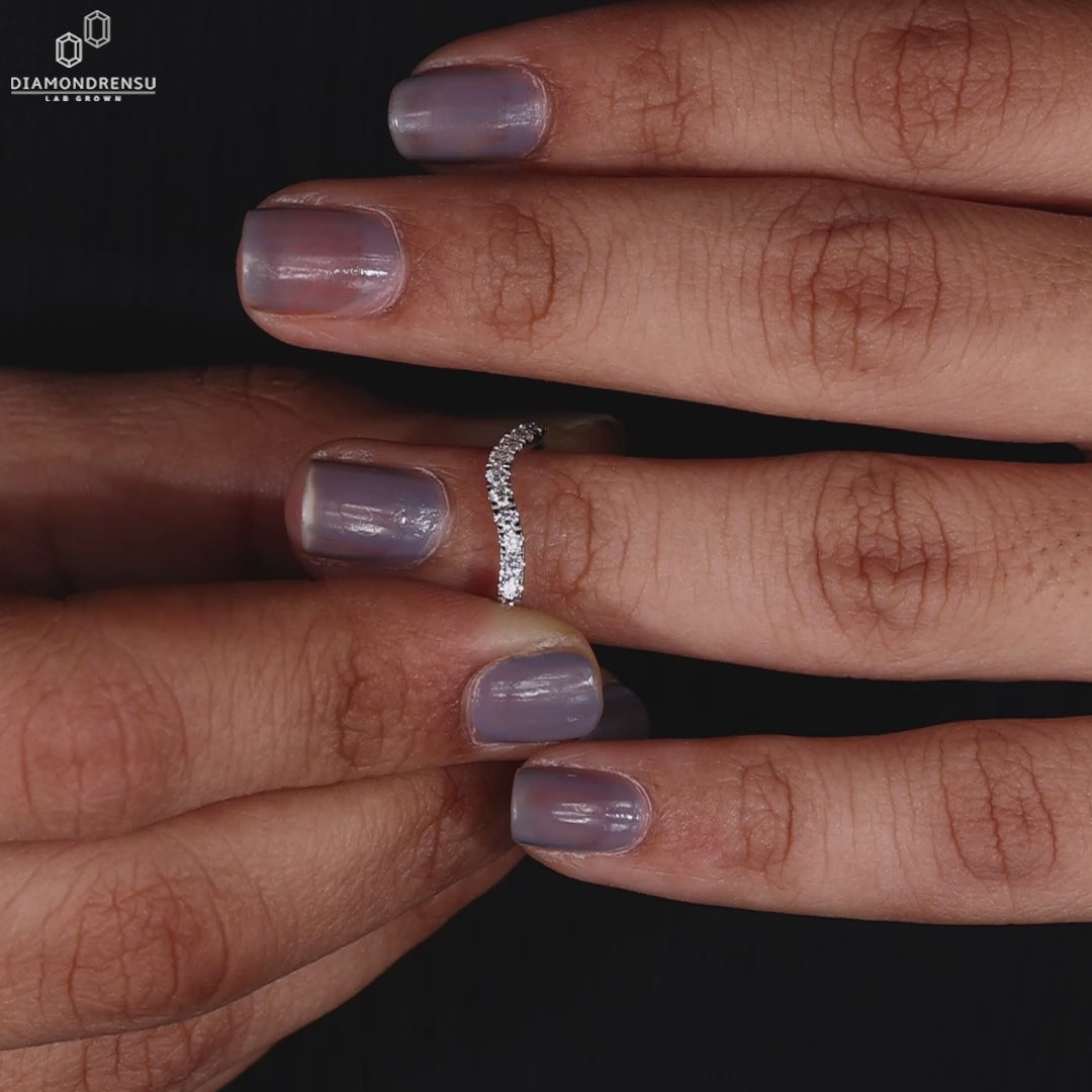White gold round diamond wedding band.