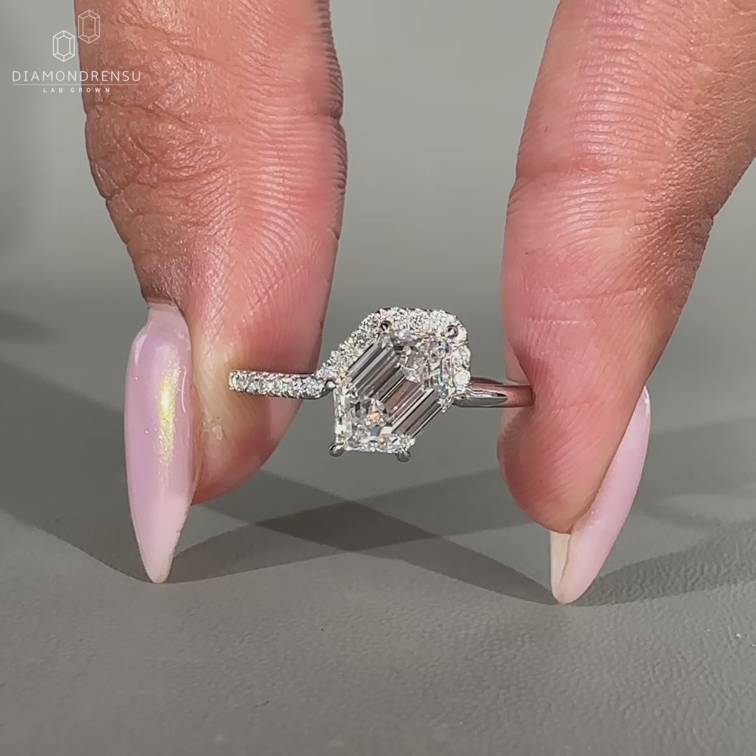 Nature inspired ring with marquise and round side stones