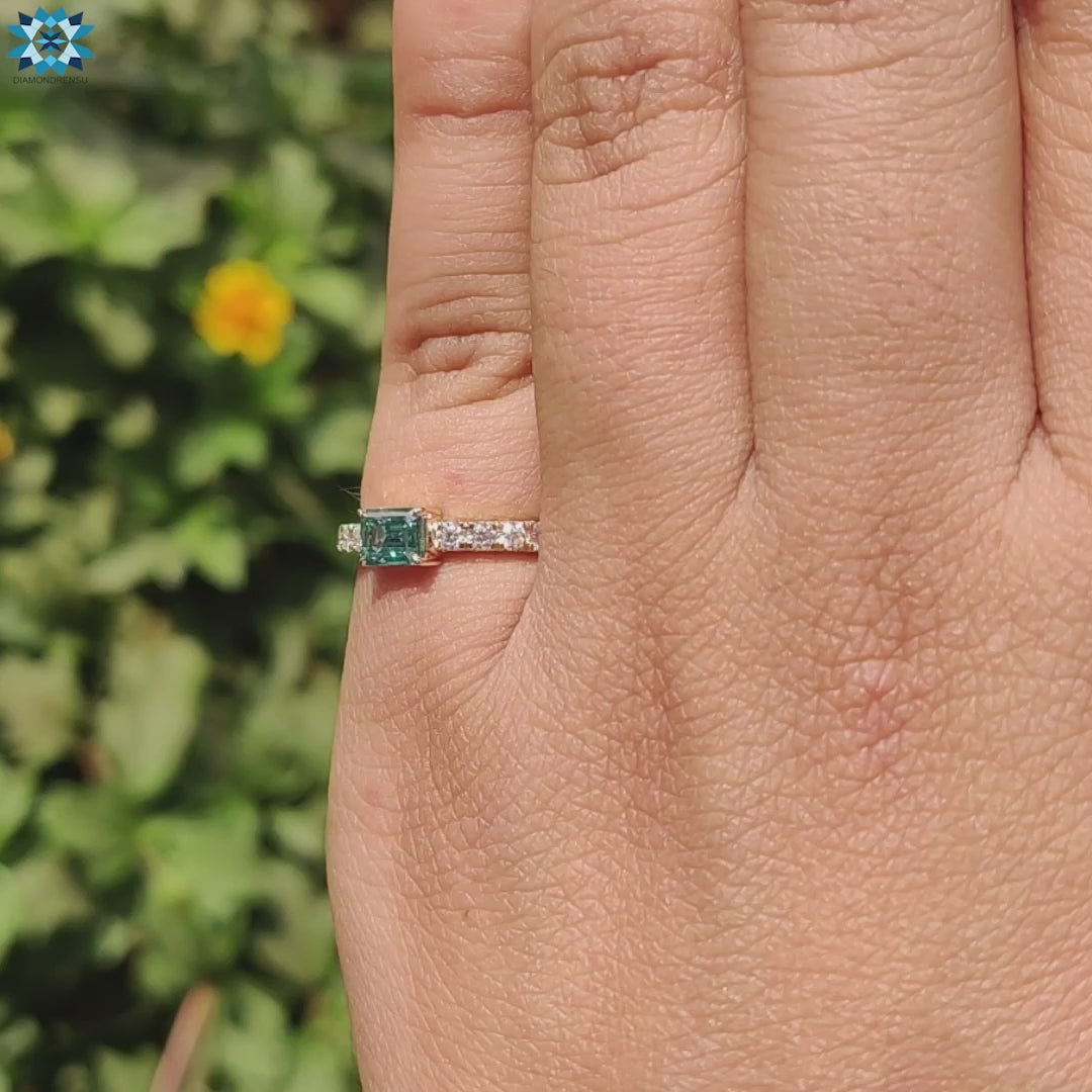 Handmade jewelry ring featuring cyan blue moissanite.