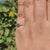 Handmade jewelry ring featuring cyan blue moissanite.
