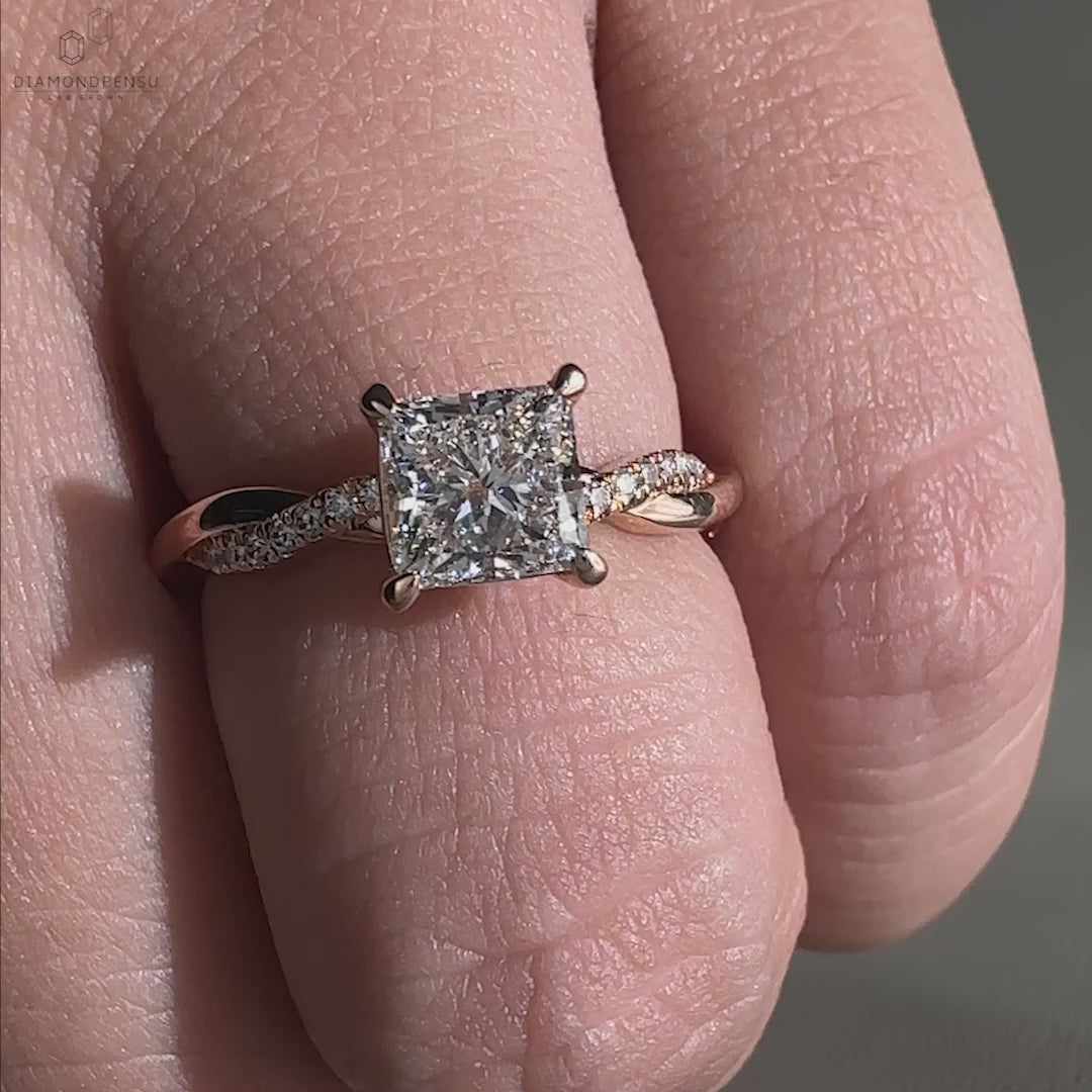 Handmade ring with a claw prong setting and a stunning princess cut engagement ring design.