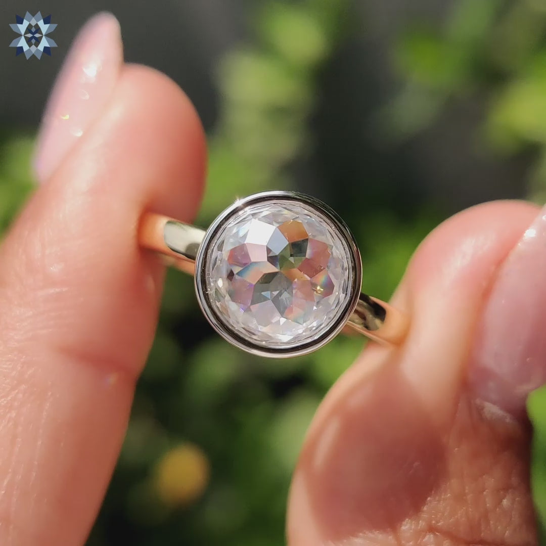 Rose cut engagement ring in white and yellow gold with modern bezel setting.