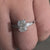 Three stone engagement ring diamond with a radiant centrepiece.
