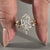Solitaire ring paired with tiara wedding band in handmade bridal set.