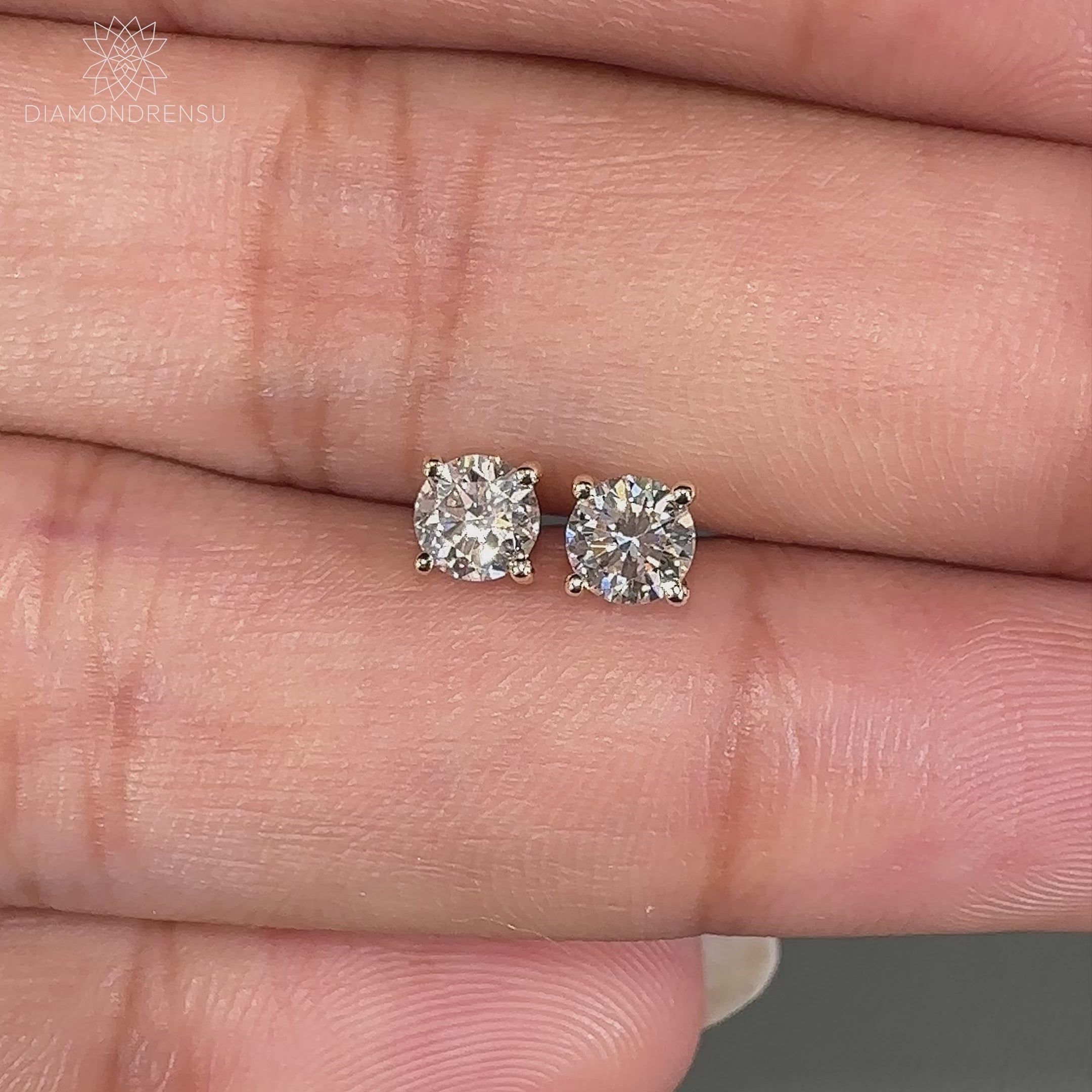 0.29 TCW diamond push back earrings.