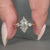 Six round prong setting marquise diamond ring