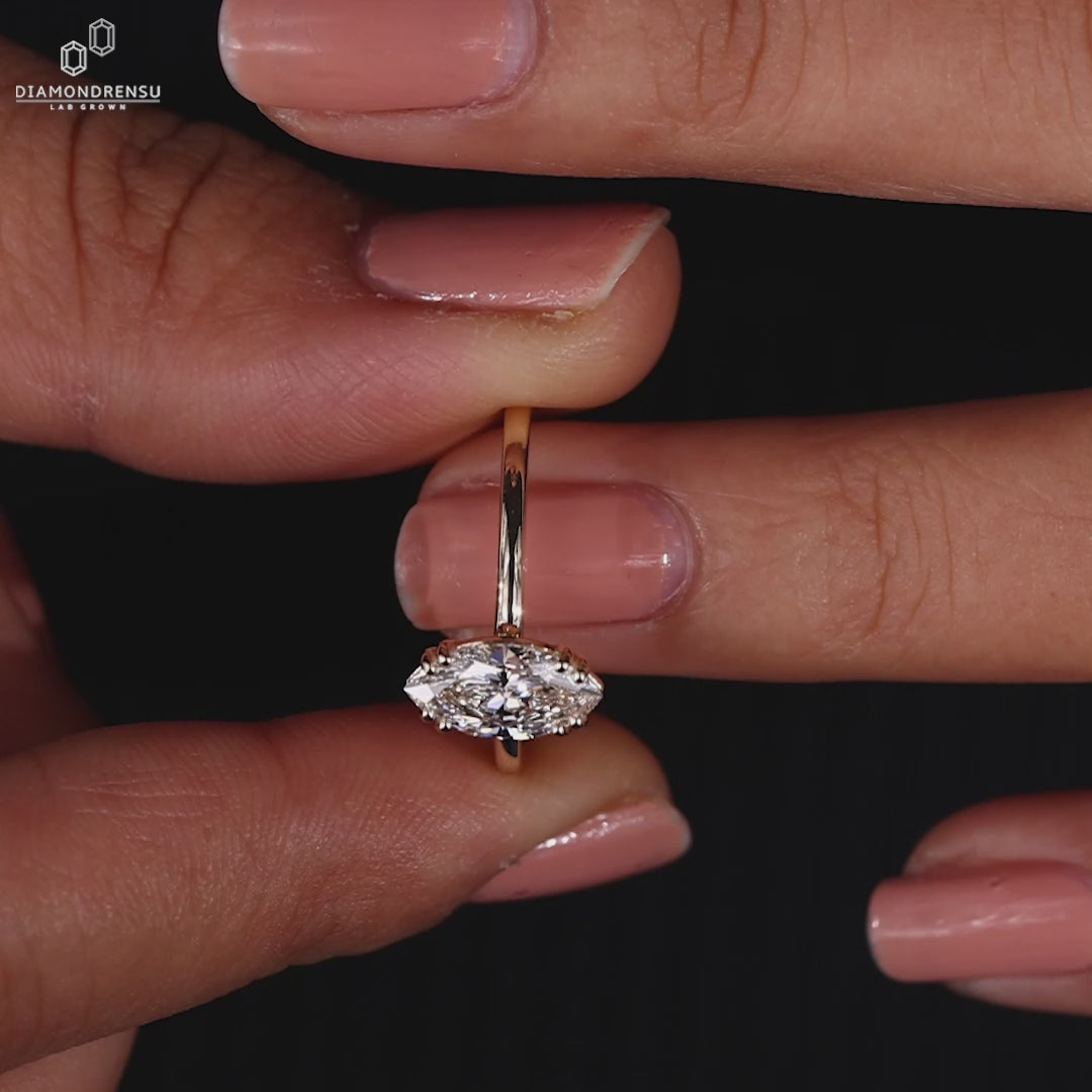 Yellow gold ring featuring solitaire diamond ring