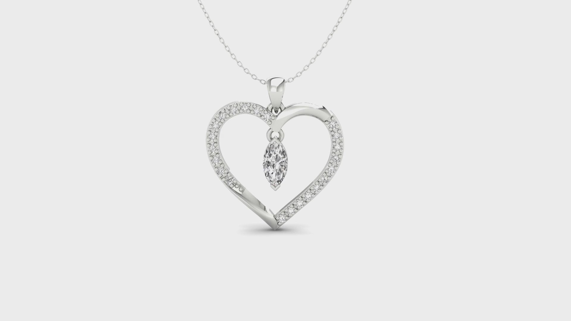 UK diamond pendant paired with heart pendant in rose gold.