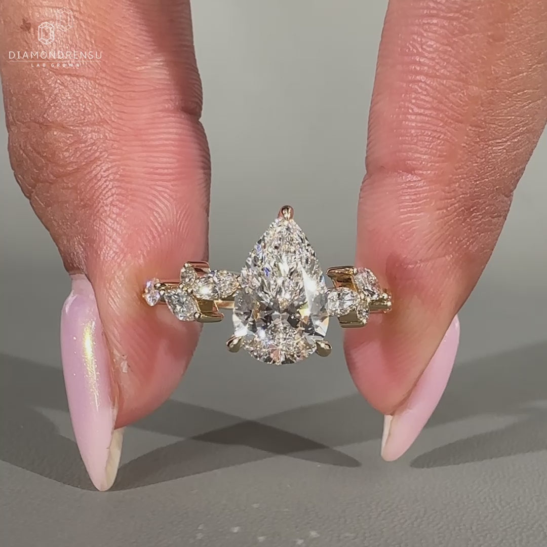 Marquise cut diamond ring with three claw prongs.