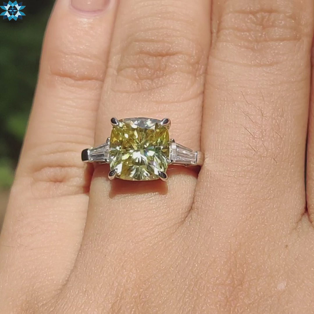 Four claw prong setting on cushion cut moissanite.