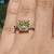 Four claw prong setting on cushion cut moissanite.