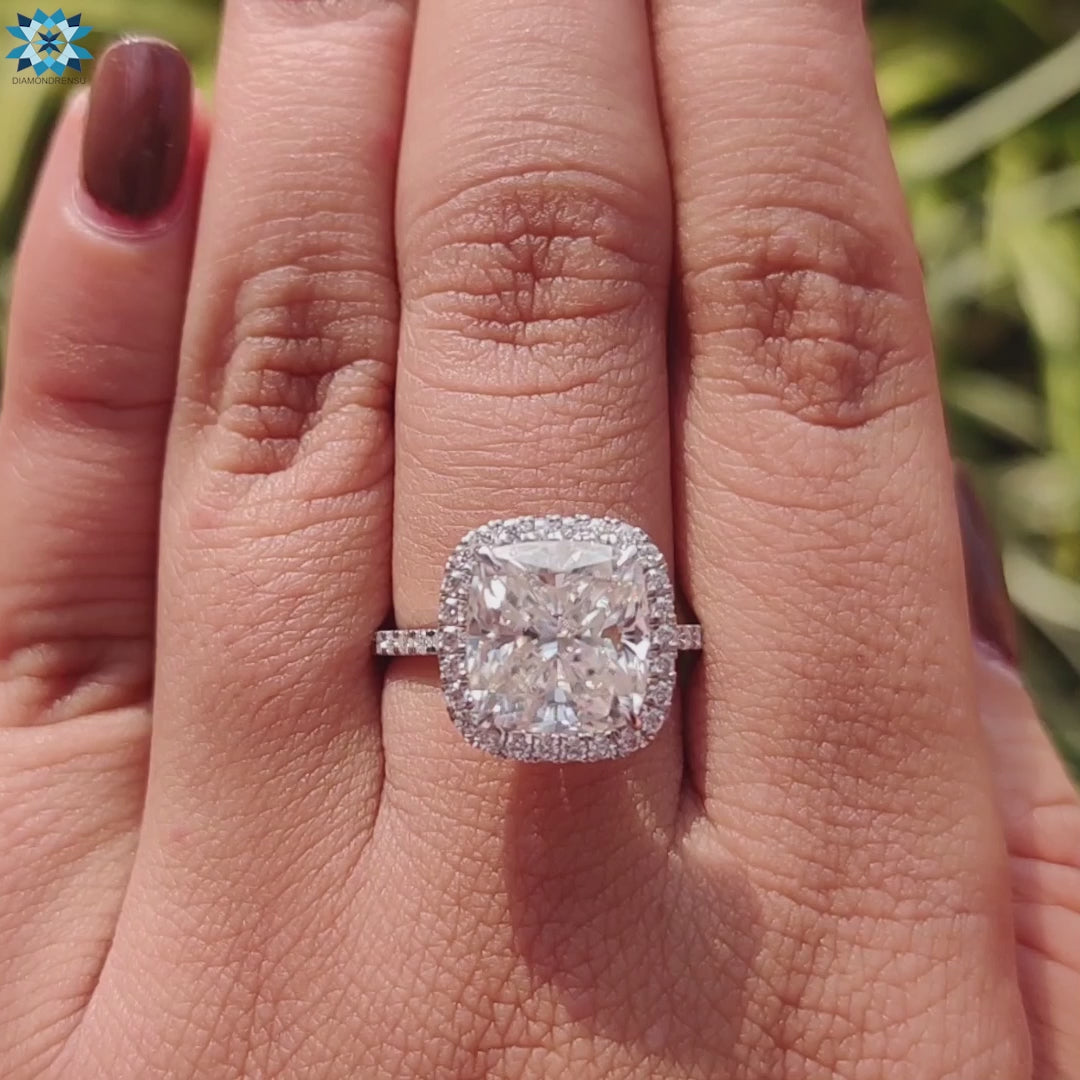Handmade cushion moissanite ring in white gold.