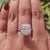 Handmade cushion moissanite ring in white gold.