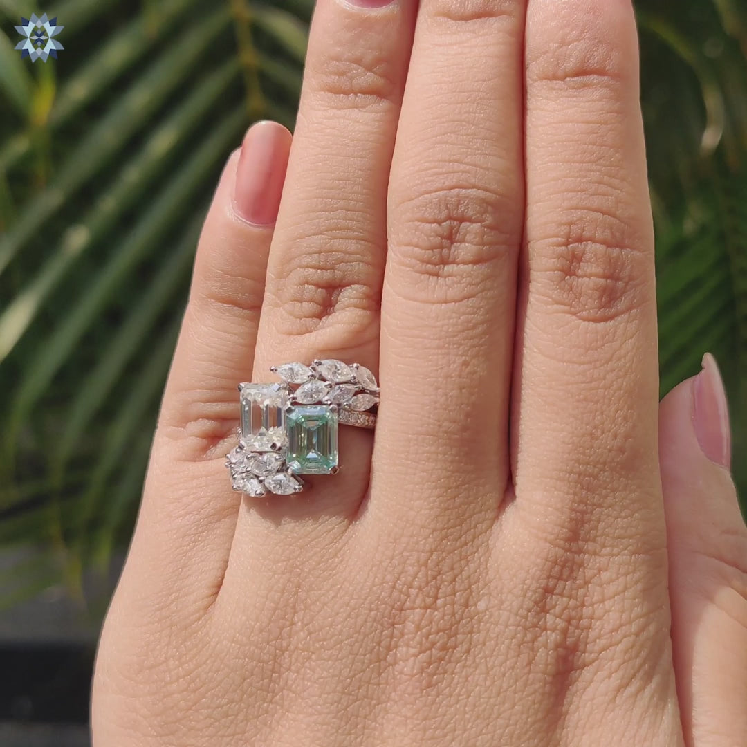 Elegant prong setting for emerald cut moissanite.