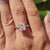 V prong setting ring with princess cut center stone.