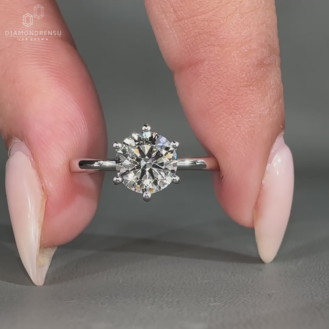 White gold engagement ring with tapered shank band