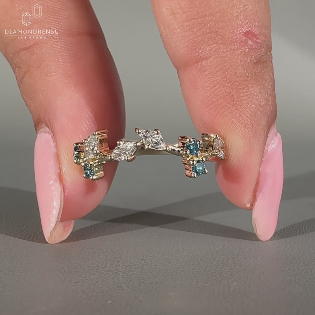 Marquise and round diamond band in prong setting.