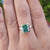 Radiant cut solitaire moissanite ring in white gold band.