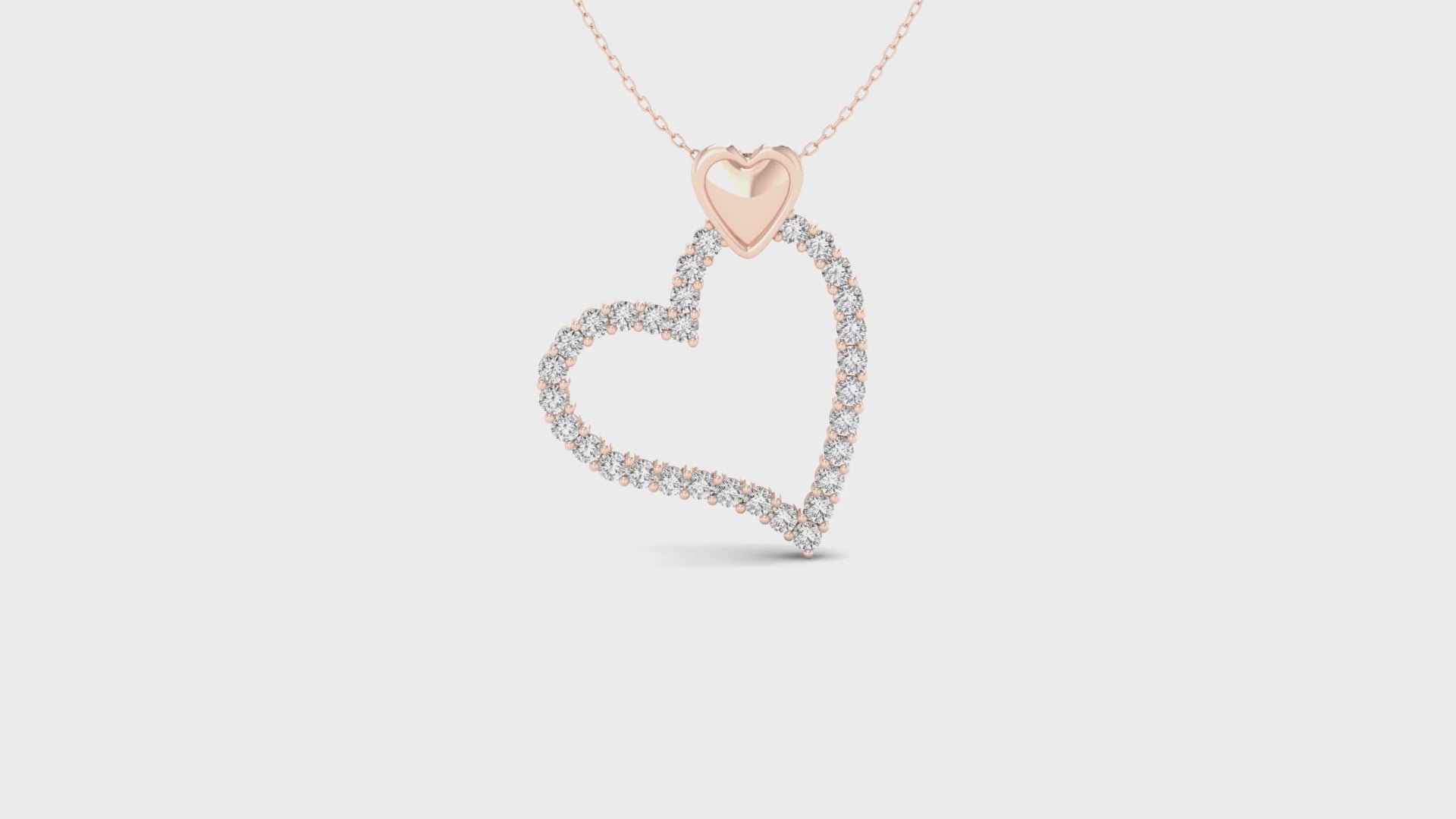White gold pendant with heart shaped setting and lab grown diamond.