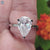 Buy pear solitaire moissanite ring in white gold.