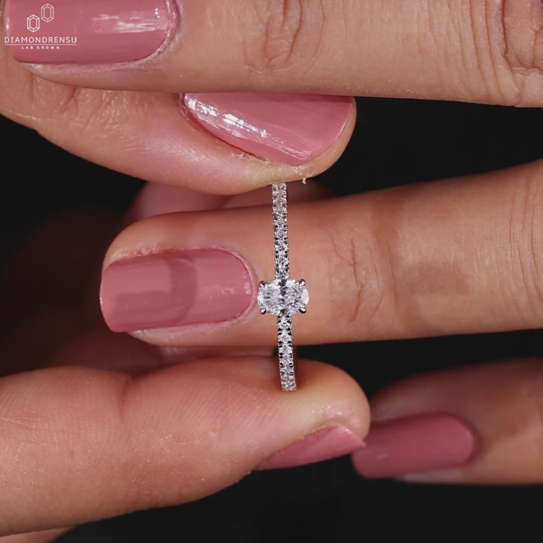 Pave diamonds set in a handmade ring with a hidden halo, designed to impress for any special moment.