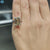 Double prong solitaire ring with criss cut center stone.