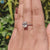 Moissanite solitaire ring with classic prong setting.