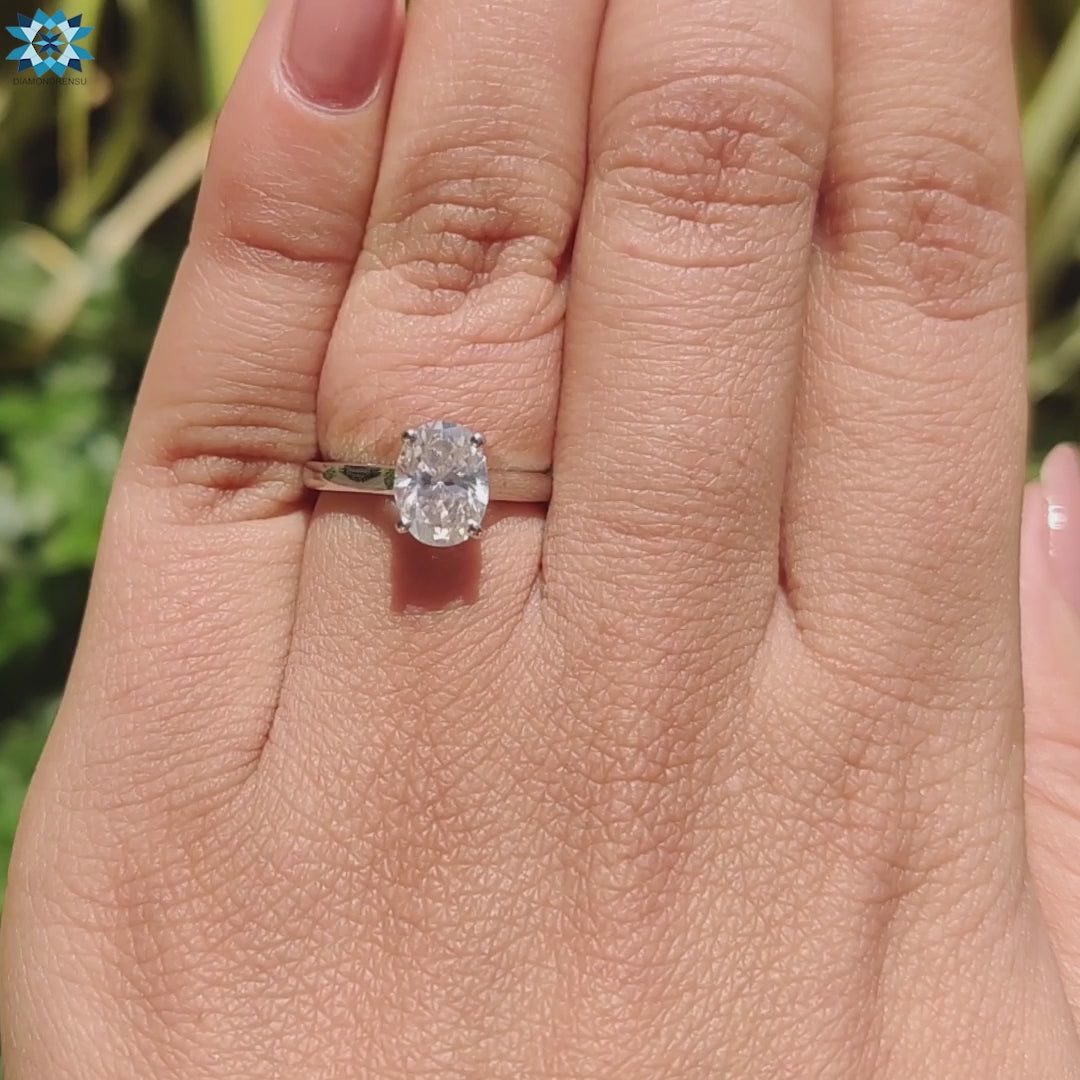 UK engagement ring with a handmade jewelry design and oval moissanite.