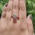 Elegant bezel set engagement ring with round moissanite.