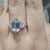 Prong set hexagon moissanite ring in white gold.