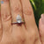 Custom engagement ring in prong setting with upside down pear cut centre stone.