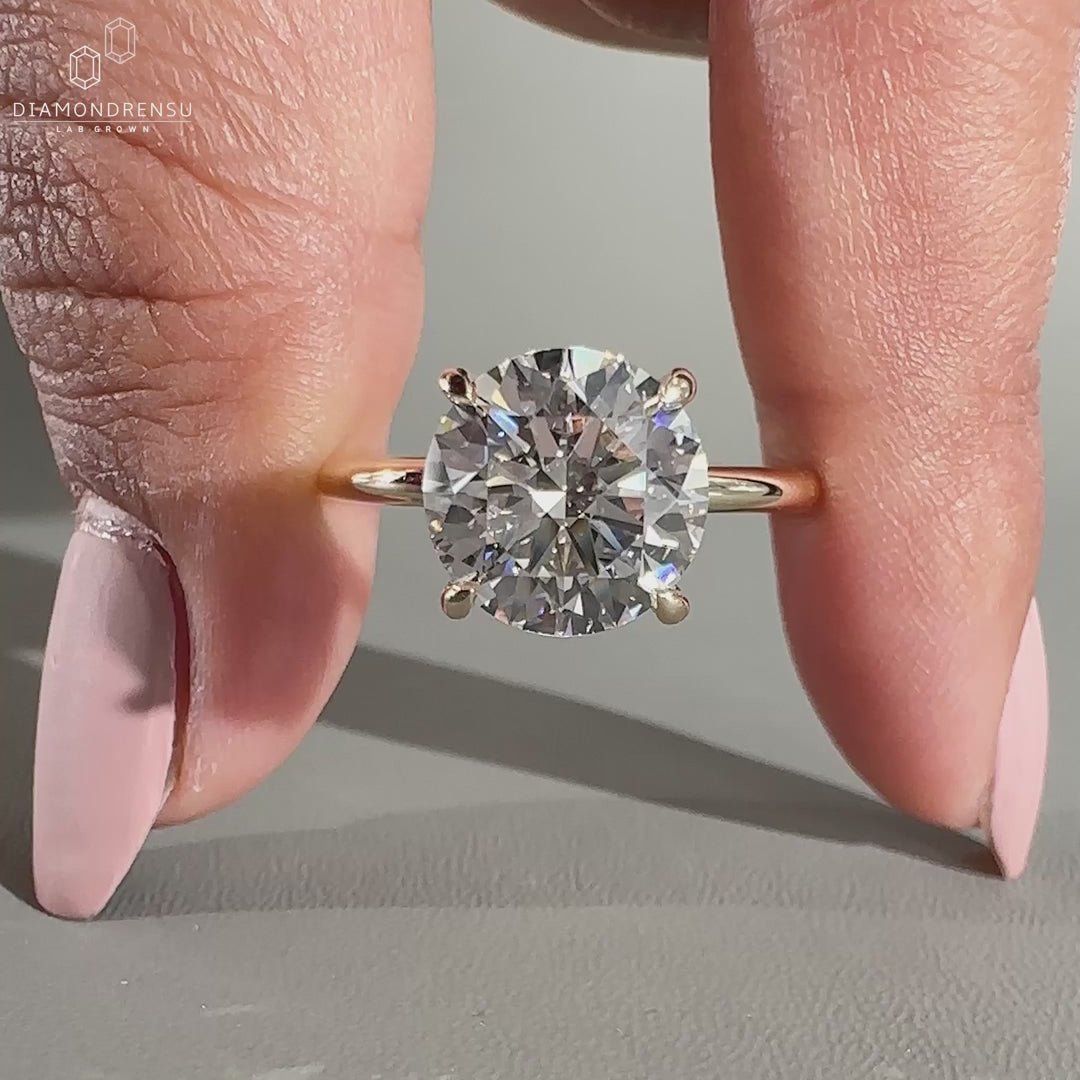 Solitaire engagement ring crafted in yellow gold.